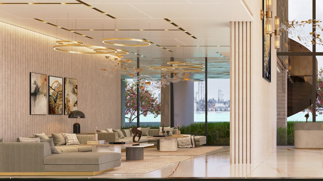 Modern condominium lobby with comfortable seating and decorative lighting
