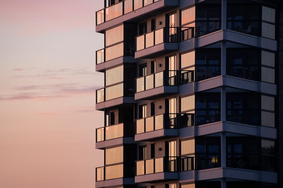 Modern condominium building exterior at dusk