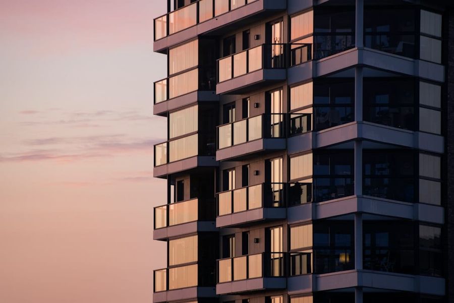 Modern condominium building exterior with warm daylight